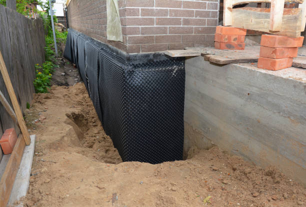 Happy homeowners after waterproofing job in Okemos